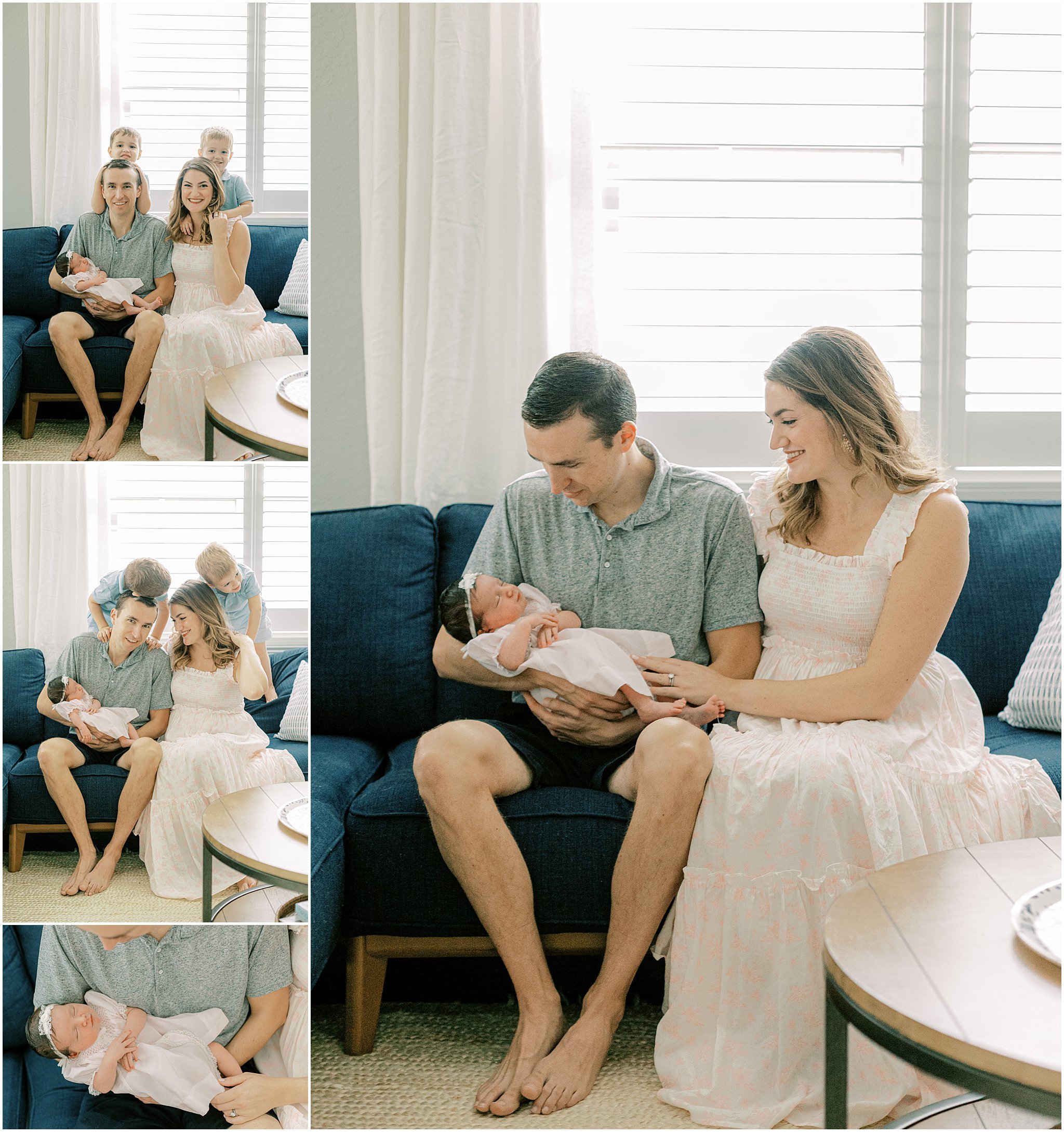 family sitting on sofa taking photos with newborn